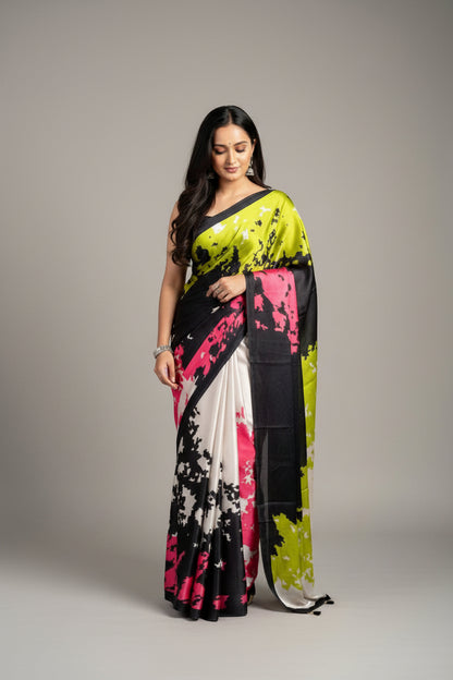 Woman wearing a colorful saree with a gradient design on a plain background