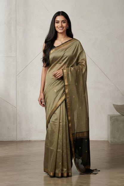 Woman wearing a traditional saree with a neutral background
